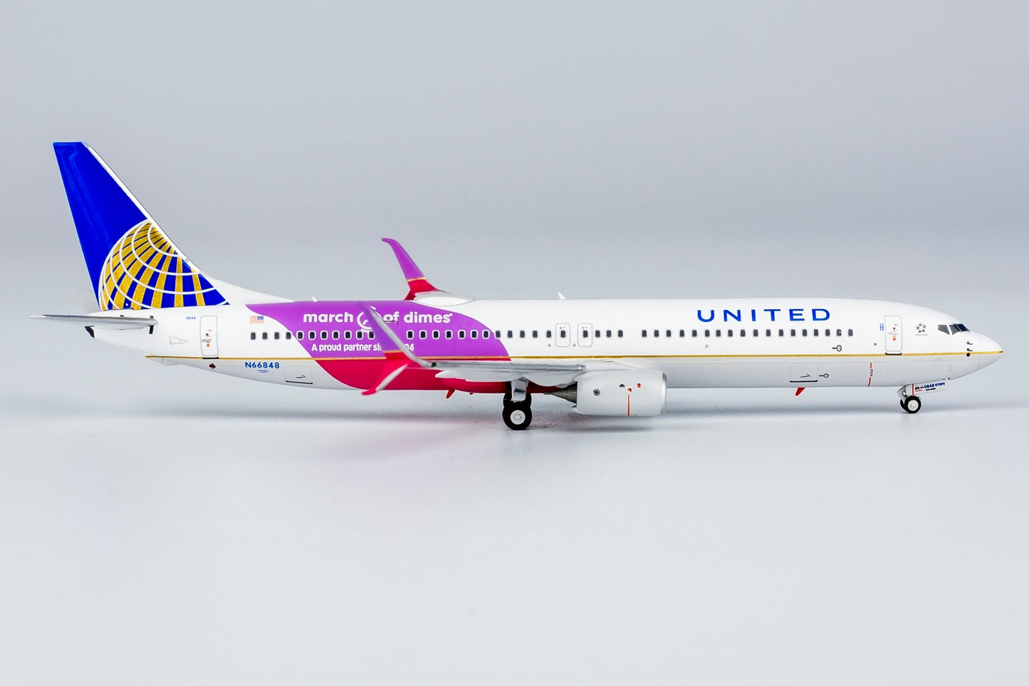 1:400 United Airlines B737-900ER "CO-UA merged livery; with scimitar winglets; March of Dimes" NG Models