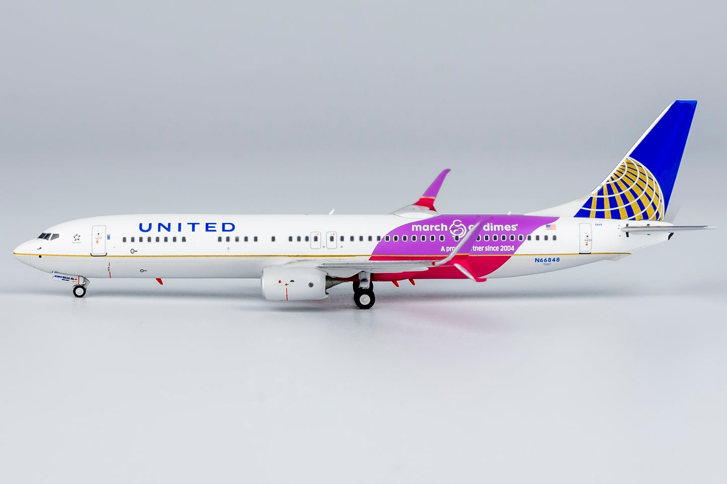 1:400 United Airlines B737-900ER "CO-UA merged livery; with scimitar winglets; March of Dimes" NG Models